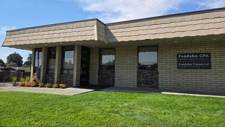 The Fondahn CPA office: a single-story brick building with Fondahn CPA and Fondahn Financial signs on the wall